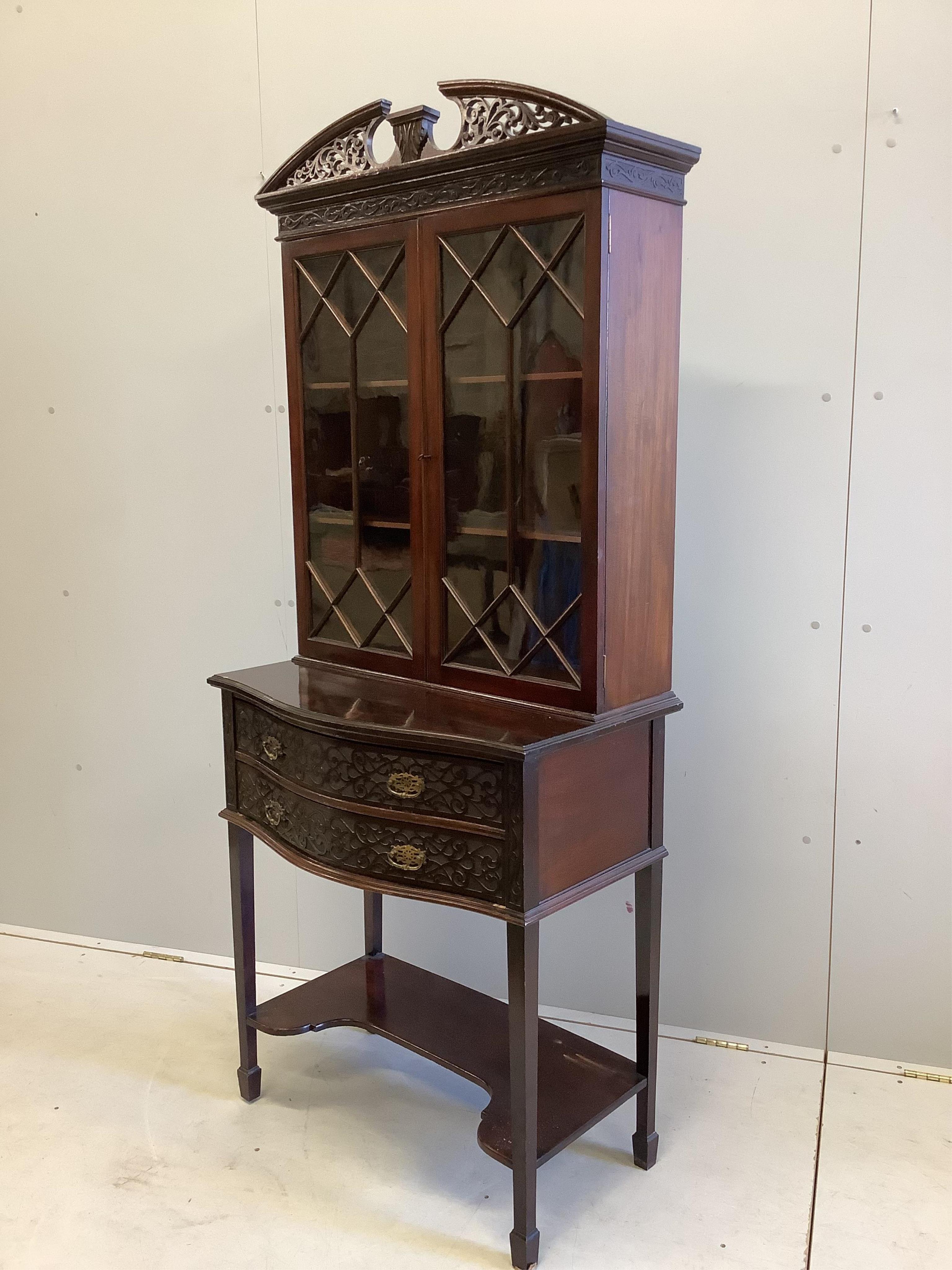 An Edwardian Chippendale Revival blind fret bowfront mahogany bookcase, width 76cm, depth 44cm, height 180cm